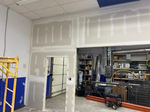 Drywall finishing around doorways in a commercial space